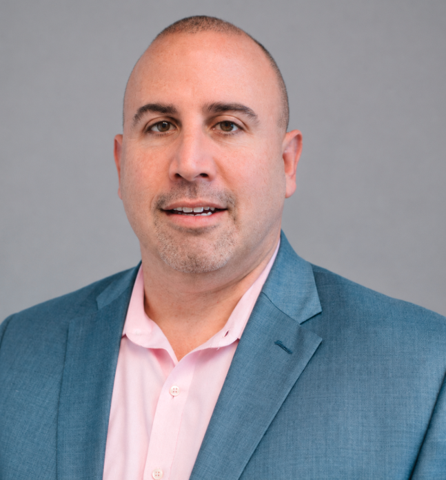 Professional photo with grey background of Mitch Abrams, PsyD